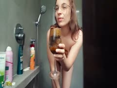 Gorgeous teen drinking wet poop in wine glass